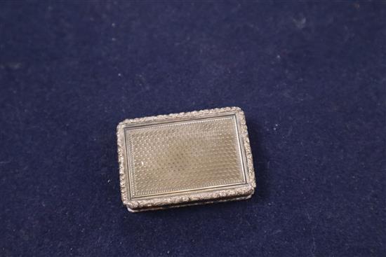 A William IV silver vinaigrette, with pierced gilt grille, engraved with a lyre, Edward Edwards II, London, 1834, 44mm.